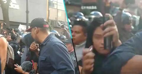 Una mujer es captada intentando prender fuego a un reportero en la CDMX
